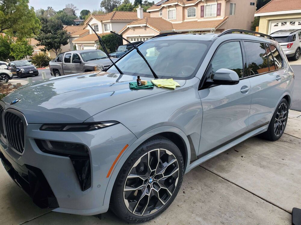 Gray BMW X7 SUV freshly ceramic coated in a driveway