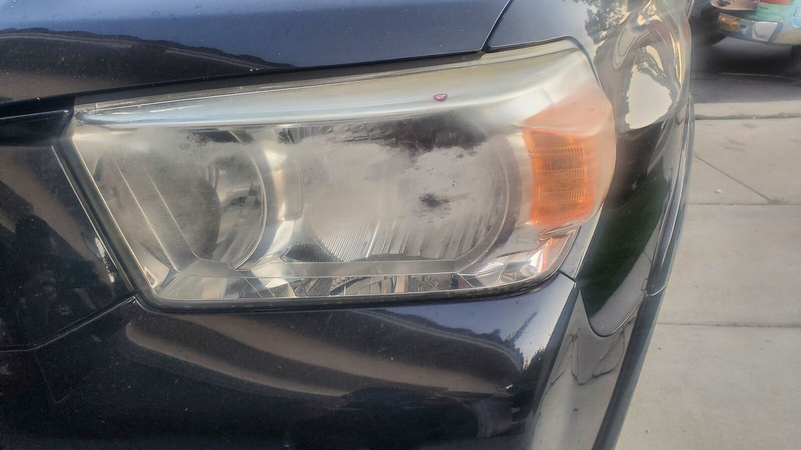Foggy, oxidized headlight before restoration